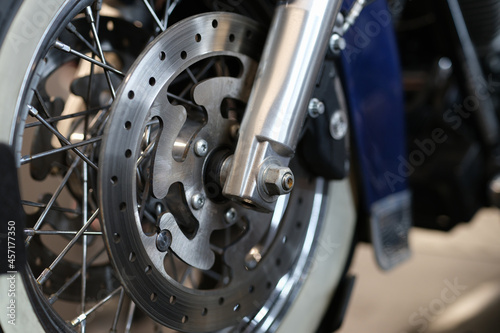 Closeup of brake disc on motorcycle wheel