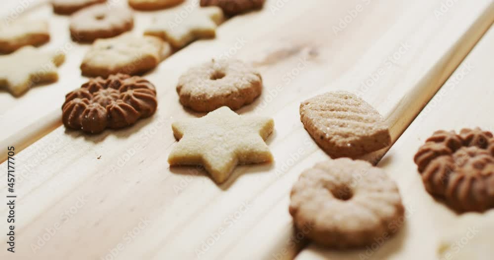 Video of assorted tasty christmas cookies on pale wooden background Video of assorted tasty christmas cookies on pale wooden background