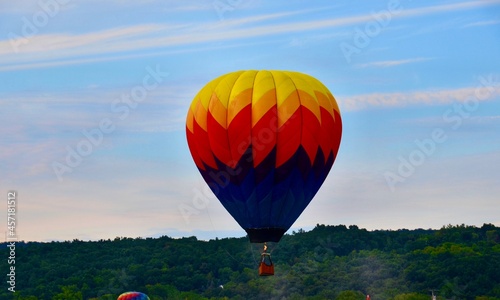 Hot air balloon flying in the sunset  