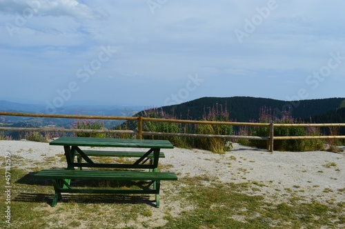 a table and a bench on a mountain lookout