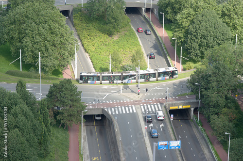 Aerial view of a highway with cars and a tram in the center of Rotterdam in the Netherlands