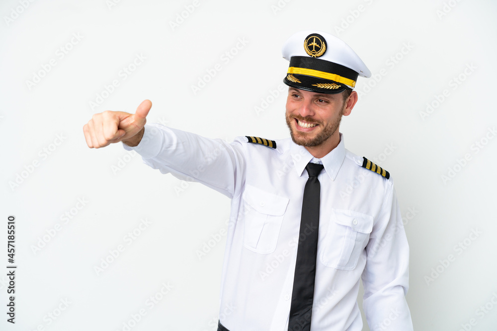 Airplane Brazilian pilot isolated on white background giving a thumbs up gesture