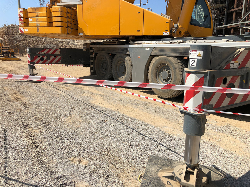Outriggers of heavy allterrain mobile crane at construction site