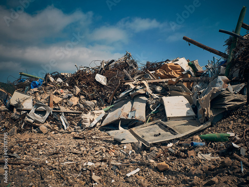 Fotografie, Obraz Metal reinforcement rods, lumber and other different kinds of construction debris piled