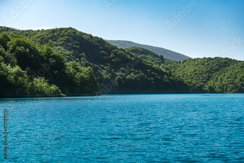 Lake located between hills in summer.