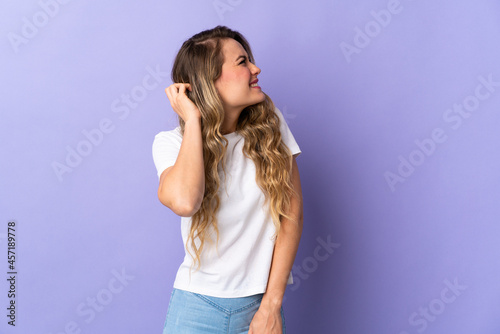 Young Brazilian woman isolated on purple background thinking an idea