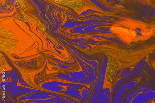 Abstract orange purple gold marble background. Acrylic painting conceptual Halloween. A festive layout for autumn greetings. The original fragment of the picture. Fashionable background for postcards.
