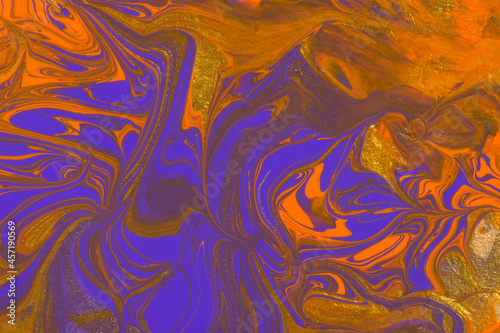 Abstract orange purple gold marble background. Acrylic painting conceptual Halloween. A festive layout for autumn greetings. The original fragment of the picture. Fashionable background for postcards.