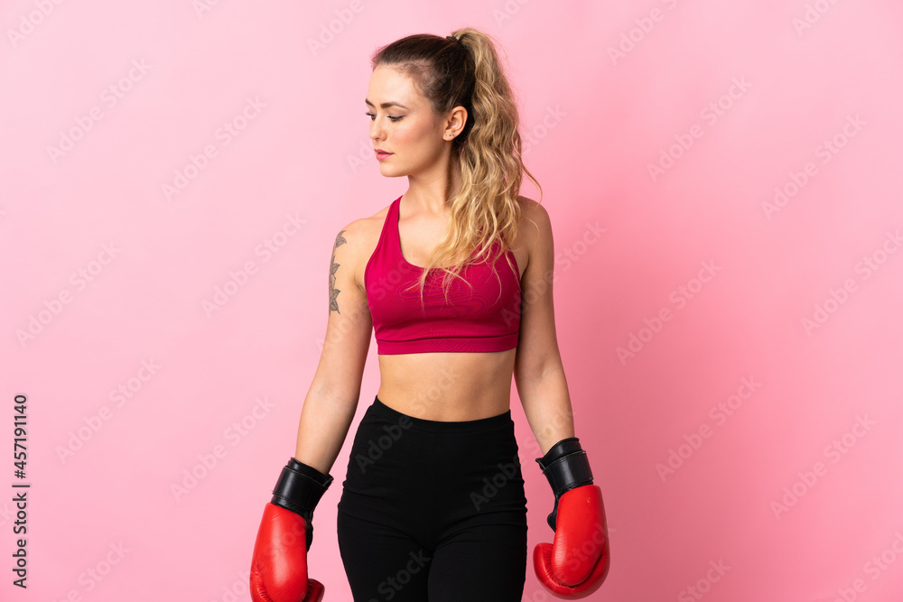 Young Brazilian woman isolated on pink background with boxing gloves Young Brazilian woman isolated on pink background with boxing gloves