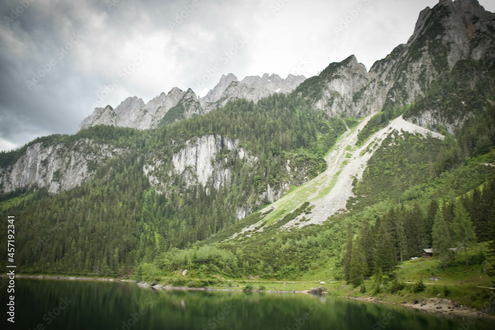 Amazing summer nature of Gosausee (Vorderer) lake with Dachstein glacieron background. Beauty of nature concept background.