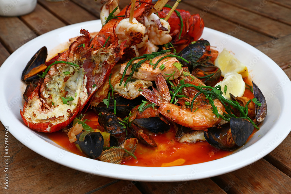 Grilled seafood platter on wooden table Grilled seafood platter on wooden table
