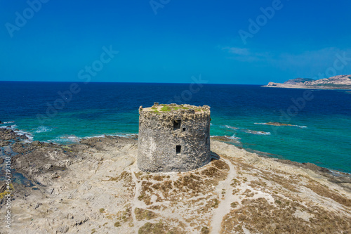 Tableau sur toile Aerial view of nuraghe in a island in Stintino, La Pelosa beach in Mediterranean sea