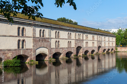 Cityscape view of the Barrage Vauban on the Ill River, originally known as the Grande Écluse (Great Lock) in the city of Strasbourg, France

 photo