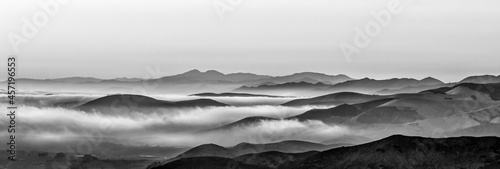 B&W panorama of Mountains, fog, clouds, layers