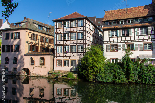 Beautiful cityscape of French and German inspired traditional half- timber framed homes along the idyllic Ill River in Strasbourg, France