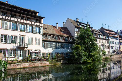 Beautiful cityscape of French and German inspired traditional half- timber framed homes along the idyllic Ill River in Strasbourg, France © Cynthia