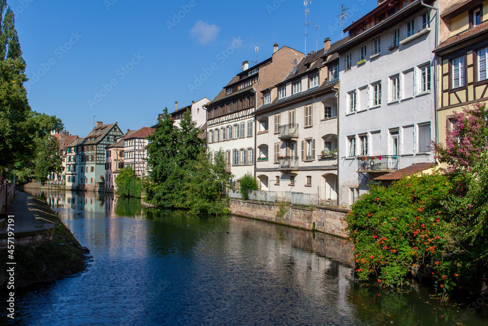 Beautiful cityscape of French and German inspired traditional half- timber framed homes along the idyllic Ill River in Strasbourg, France