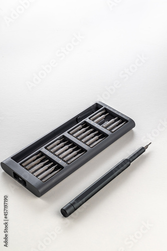 a set of small screwdriver bits in an open box