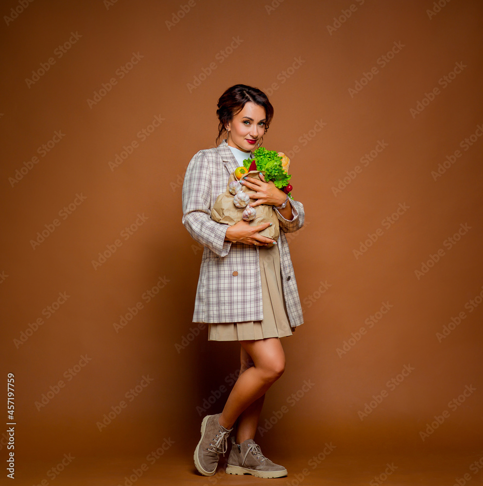 beautiful middle-aged vegan woman with food, photo in the studio beautiful middle-aged vegan woman with food, photo in the studio