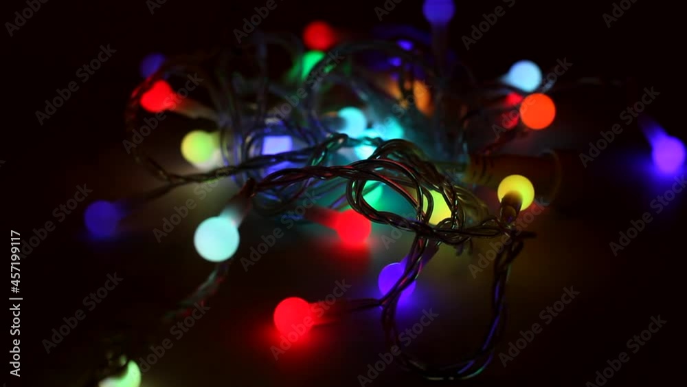 Blinking many multicolored led lamps of Christmas garland. Flashing