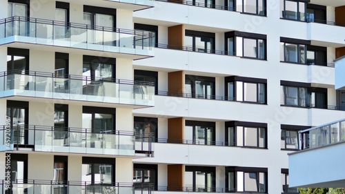 Modern apartment building on a sunny day. Architectural details and facade of a modern apartment building. © Grand Warszawski