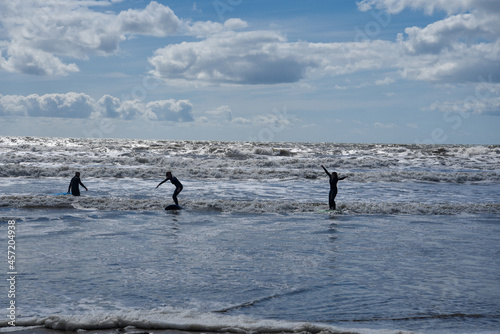 Fototapeta Surfers in Newgale, Pembrokeshire