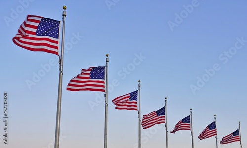 American flag of the United States of America  floating in the sky on a mast