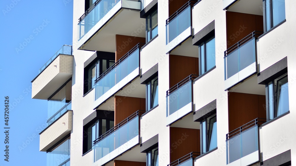 Modern apartment building on a sunny day. Architectural details and facade of a modern apartment building. Modern apartment building on a sunny day. Architectural details and facade of a modern apartment building.