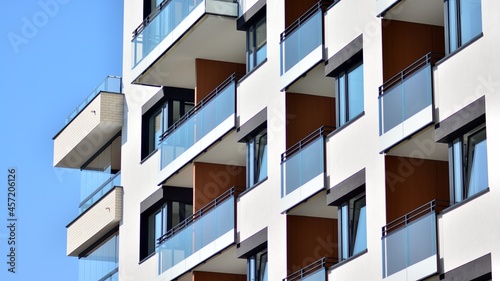 Modern apartment building on a sunny day. Architectural details and facade of a modern apartment building.