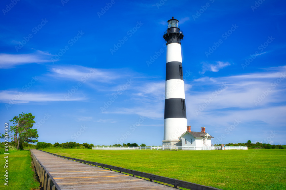 A beautiful summer of the lighthouse at Bodie Island on the Outer Banks in North Carolina. Dreamy beach look.