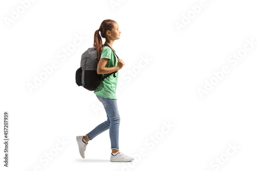 Full length profile shot of a girl carrying a backpack and walking © Ljupco Smokovski