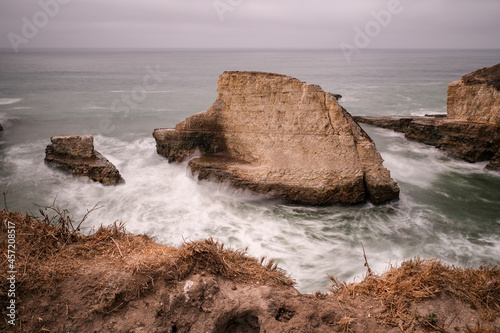 Long exposure of waves crashing on Shark Fin Cove, Davenport, California.
