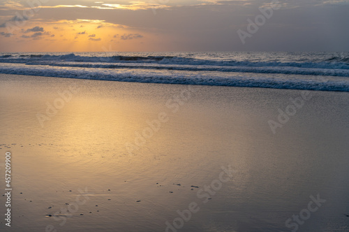 Golden Cloudy Sunrise on Beach
