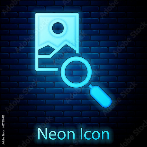 Glowing neon Photo retouching icon isolated on brick wall background. Photographer, photography, retouch icon. Vector