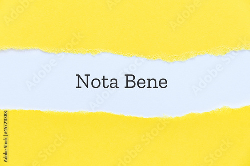 Nota bene typed on paper background for presentation slide