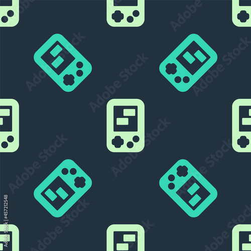 Green and beige Portable tetris electronic game icon isolated seamless pattern on blue background. Vintage style pocket brick game. Interactive playing device. Vector