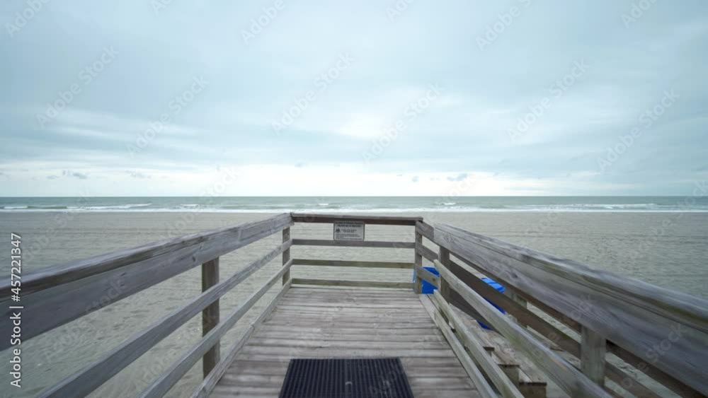 Boardwalk leading to private beach. Wide angle smooth tracking shot. Boardwalk leading to private beach. Wide angle smooth tracking shot.