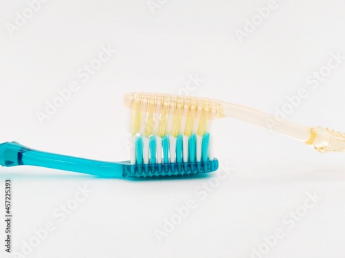 Used toothbrush on an isolated white background