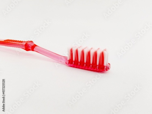 Used toothbrush on an isolated white background