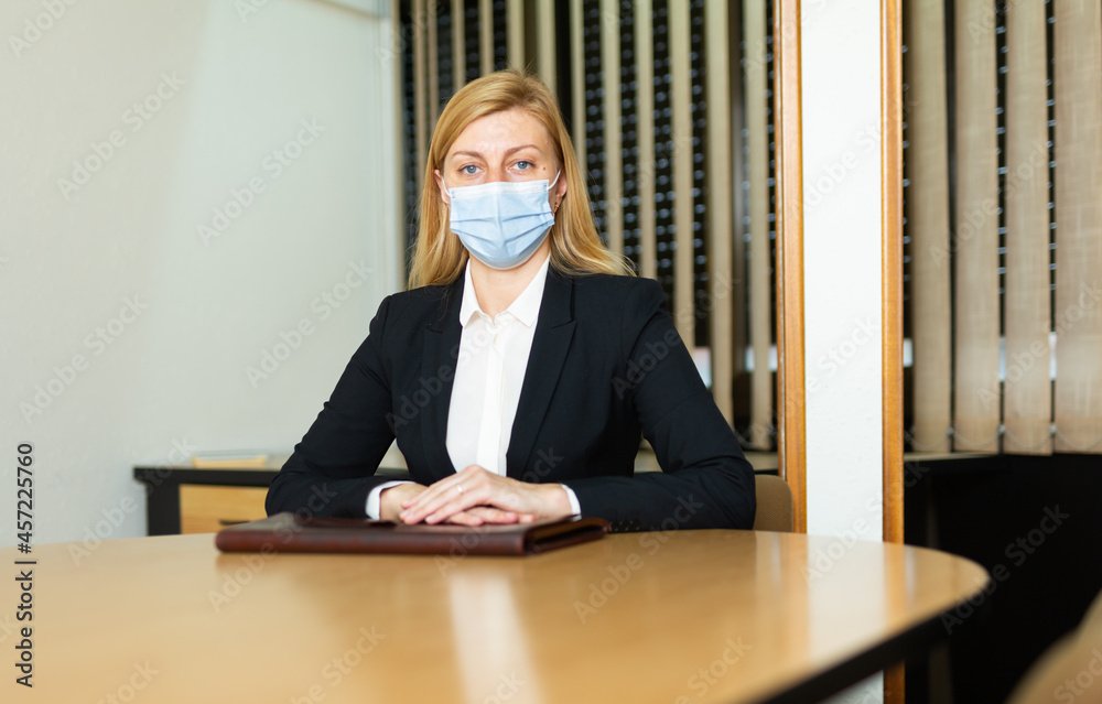 Εκτύπωση καμβά Portrait of successful business woman in face mask with briefcase posing in mode