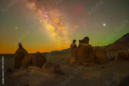 Three hoodoos sit under three planets (from left to right: Mars, Saturn, Jupiter) in the clear Utah night sky. photo