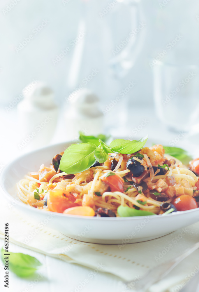 Spaghetti Pasta with Vegetables and fresh Basil on bright Background. Close up. Spaghetti Pasta with Vegetables and fresh Basil on bright Background. Close up.