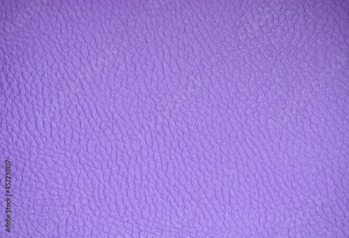 Fragment of genuine leather artificially dyed bright purple.