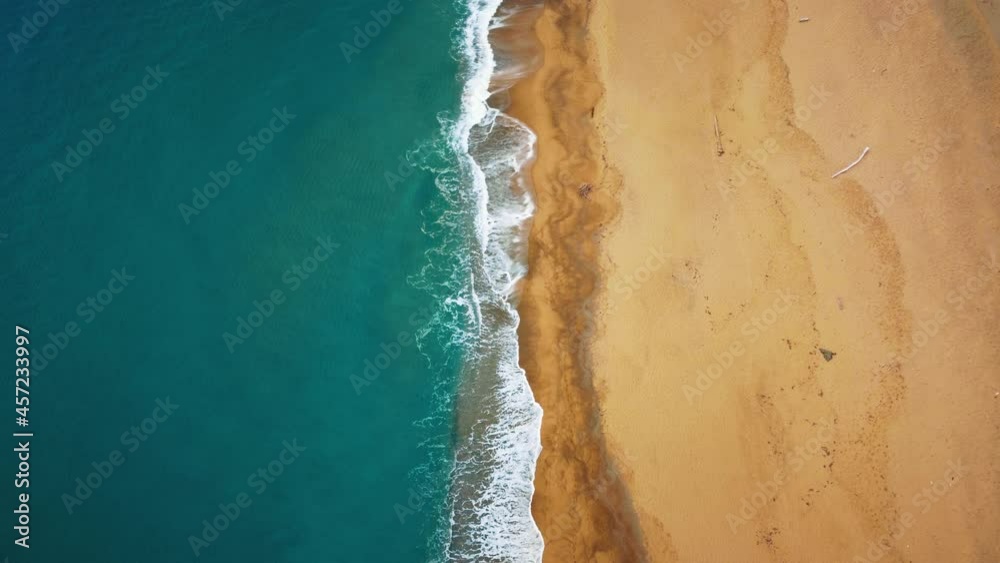 Cinemagraph seamless video loop at the seaside on the island Sardinia in Italy. Aerial of natural white sand beach tourist vacation sea coast bay with clear blue water and yellow sand. Calm animation