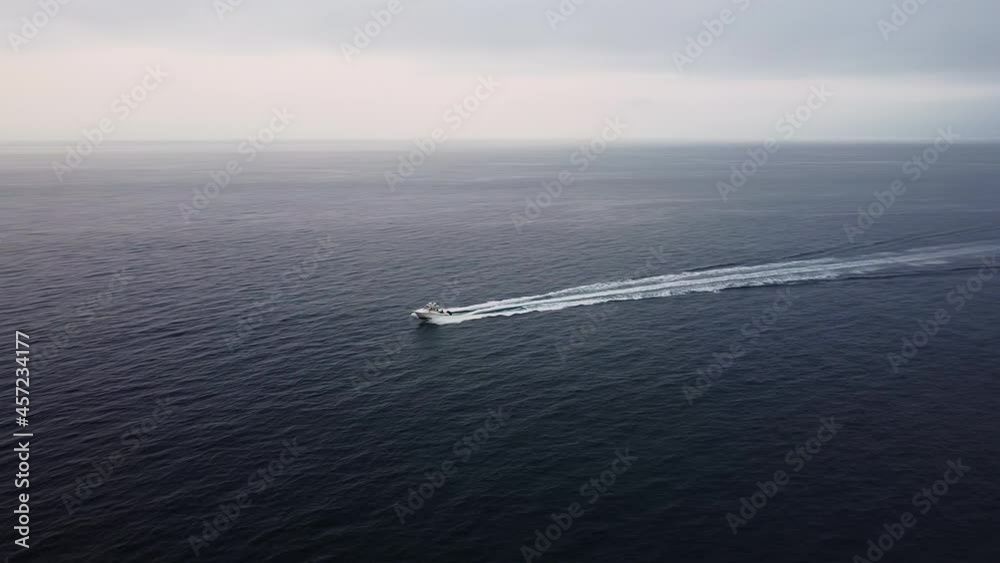 Aerial View as Speedboat Arrives Avalon Harbor, Catalina Island on Misty Morning Aerial View as Speedboat Arrives Avalon Harbor, Catalina Island on Misty Morning
