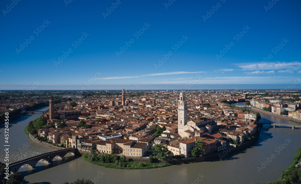 Italian medieval city drone view. Aerial panorama of Verona, Italy. Panoramic top view of Verona city center. Italian churches in the old city aerial view. Historic Italian town panorama top view.