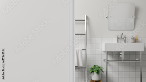 Foreground wall or White wall fragment over blurred white modern bathroom