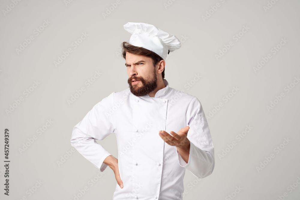 bearded man chef kitchen Job hand gestures light background