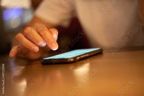blurred choosing and ordering food using a smartphone during a pandemic, horizontal.