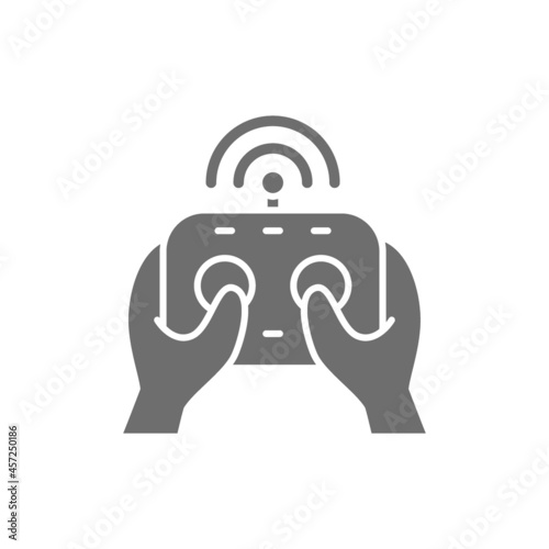 Hands holds remote controller, control panel for drone, gamepad grey icon.
